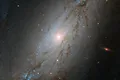 Telescopul Hubble a surprins imaginea unei galaxii uimitoare cu un centru nefiresc de gol