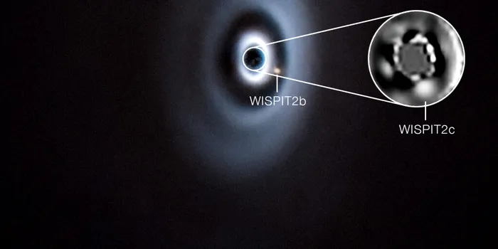 Un sistem solar în devenire? Două planete, surprinse în formare în discul unei stele tinere