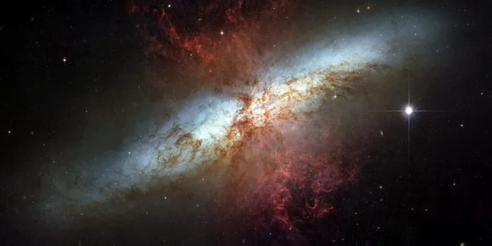 Telescopul Hubble a observat o galaxie care formează stele de 10 ori mai rapid decât Calea Lactee