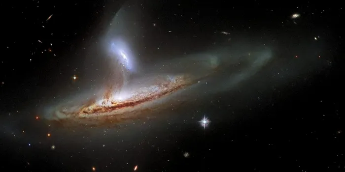 O imagine fantastică făcută de Telescopul Hubble arată interacțiunea dintre două galaxii