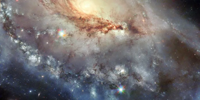 Telescopul Hubble a surprins o galaxie spectaculoasă care ascunde un defect major