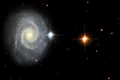 Telescopul Hubble a observat lumina „interzisă” de la o galaxie spiralată