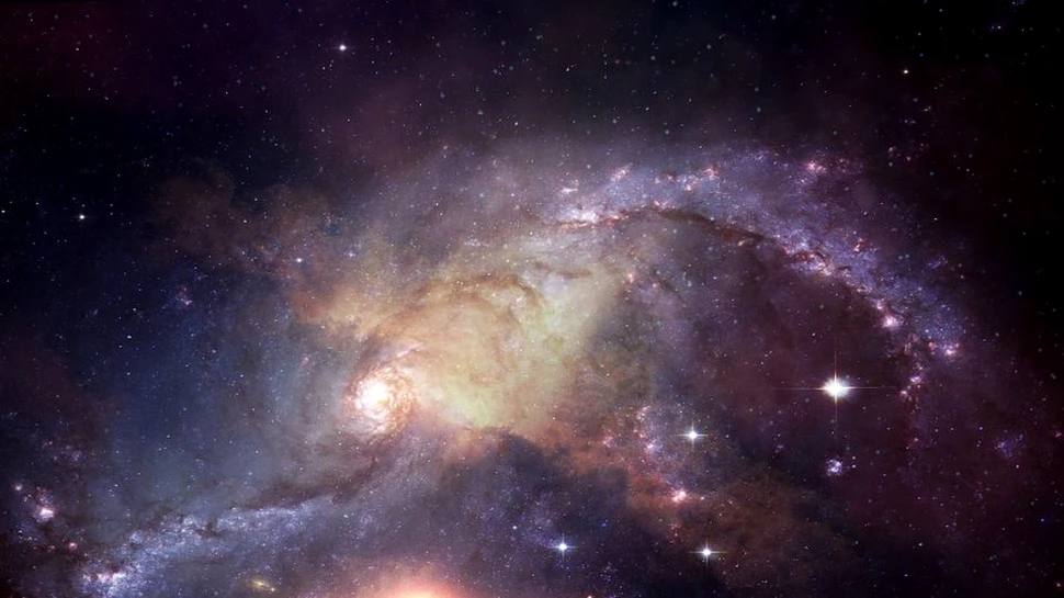 Astronomii au identificat cel mai timpuriu caz în care două galaxii fuzionează