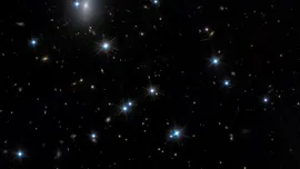 Telescopul Hubble a depistat o galaxie aproape invizibilă