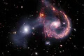 O coliziune galactică la 465 de milioane de ani-lumină depărtare de Pământ, observată cu Telescopul Webb
