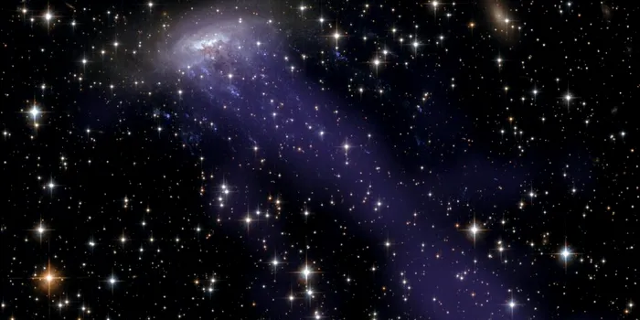 Astronomii au observat o galaxie cu tentacule de pe vremea când Universul era mult mai tânăr