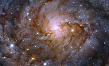 Telescopul Hubble a observat o galaxie uimitoare, ascunsă în spatele Căii Lactee
