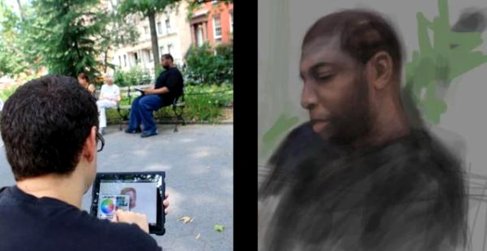 Un artist picteaza cu degetele pe ecranul iPad