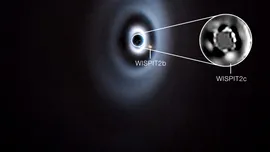 Un sistem solar în devenire? Două planete, surprinse în formare în discul unei stele tinere