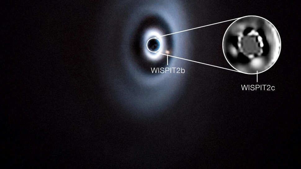 Un sistem solar în devenire? Două planete, surprinse în formare în discul unei stele tinere