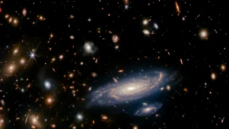 Astronomii au descoperit „galaxii abia născute” cu ajutorul Telescopului Webb