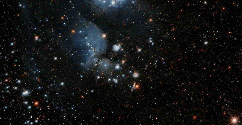 Telescopul Hubble a „tras cu ochiul” la coconii care formează stele într-o galaxie vecină
