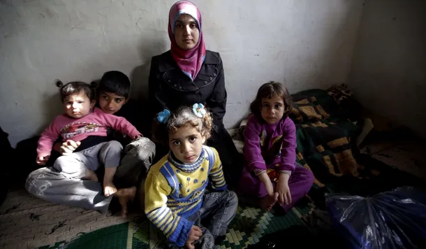Familie de refugiaţi sirieni