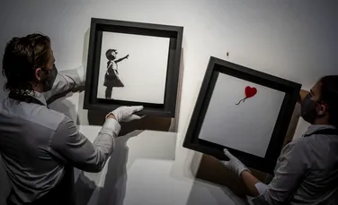 Un tablou al lui Banksy, pe jumătate distrus, vândut la licitaţie cu 22 de milioane de euro