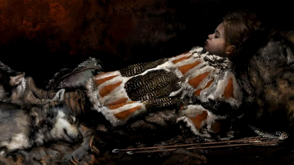 Un copil din Epoca de Piatră, îngropat cu pene de pasăre, fibre de plante și blănuri