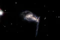 O imagine spectaculoasă cu trei galaxii îndepărtate, surprinsă de Hubble