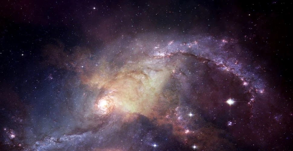 Astronomii au identificat cel mai timpuriu caz în care două galaxii fuzionează