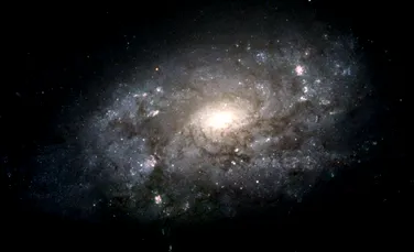 Telscopul spaţial Hubble a prezentat ,,Galaxia Ascunsă,” una dintre cele mai luminoase din Univers-FOTO